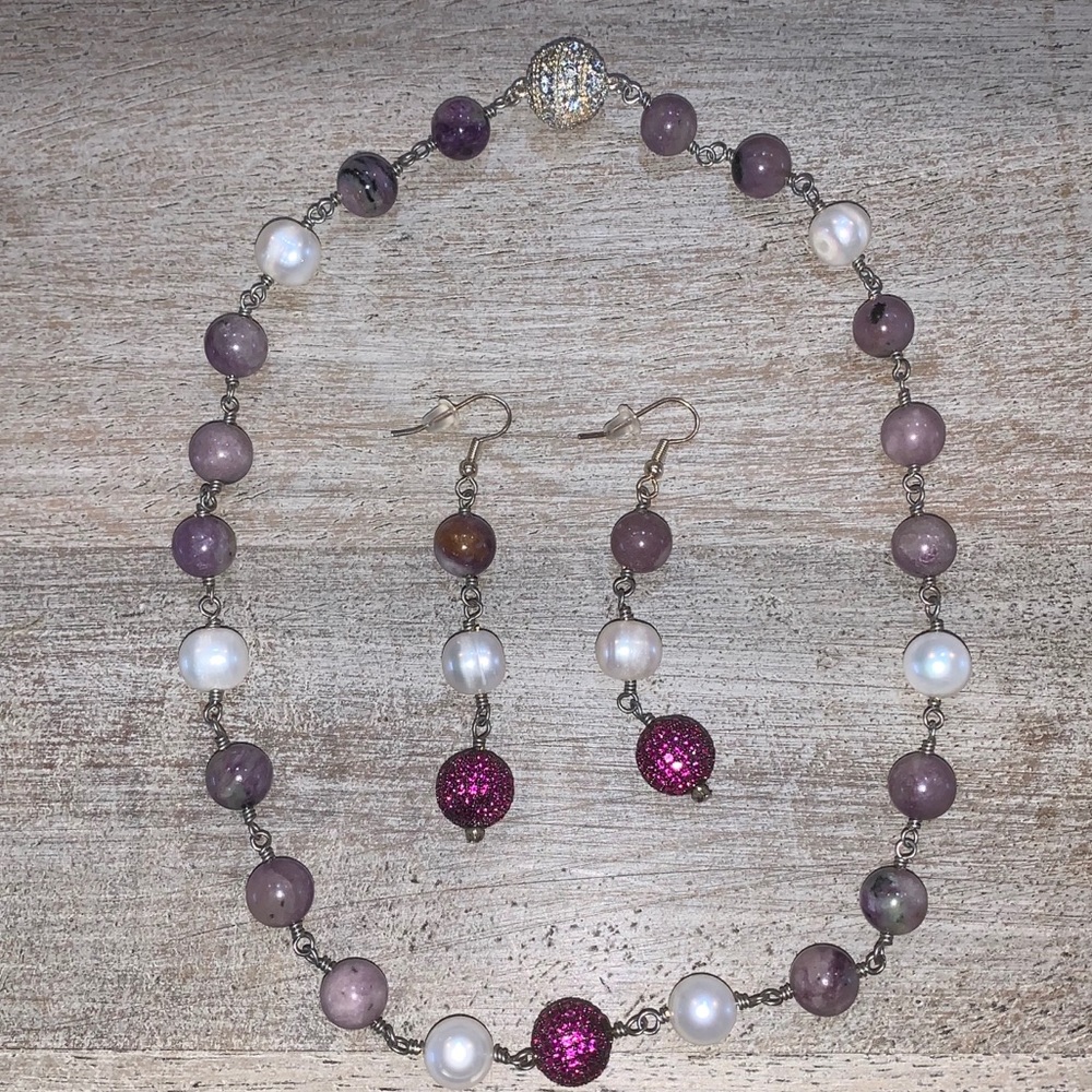Raspberry pave necklace surrounded by Charoite